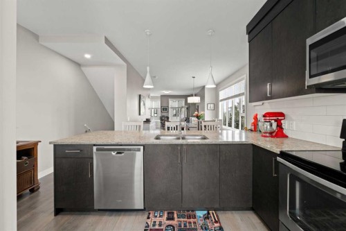 512 Drake Landing Wynd, Okotoks, AB - Indoor Photo Showing Kitchen With Double Sink
