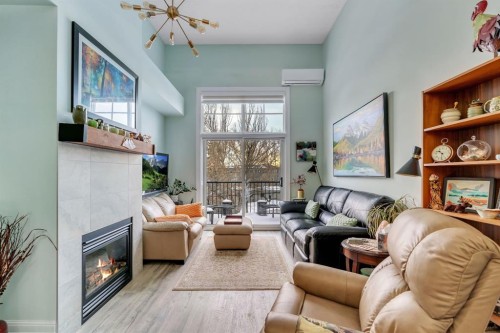 304-518 33 Street Nw, Calgary, AB - Indoor Photo Showing Living Room With Fireplace