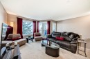 10-21 Mckenzie Towne Gate Se, Calgary, AB  - Indoor Photo Showing Living Room 