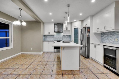 58 Lakeview Bay, Chestermere, AB - Indoor Photo Showing Kitchen With Upgraded Kitchen