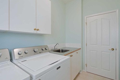 108 Hamptons Heights Nw, Calgary, AB - Indoor Photo Showing Laundry Room
