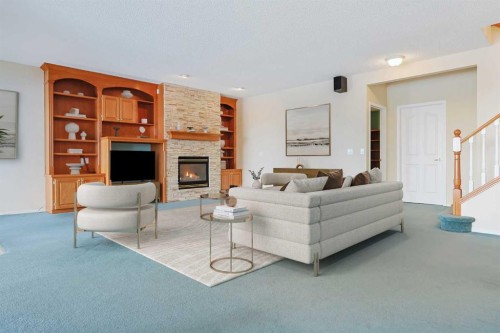 108 Hamptons Heights Nw, Calgary, AB - Indoor Photo Showing Living Room With Fireplace