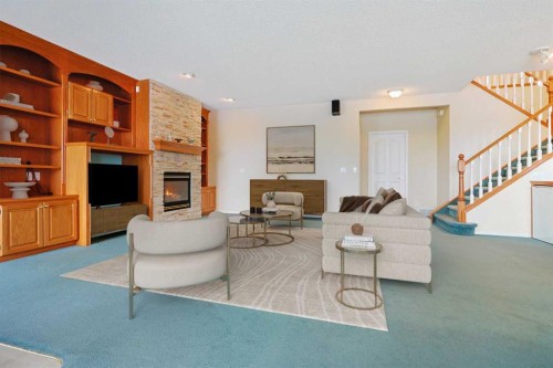 108 Hamptons Heights Nw, Calgary, AB - Indoor Photo Showing Living Room With Fireplace