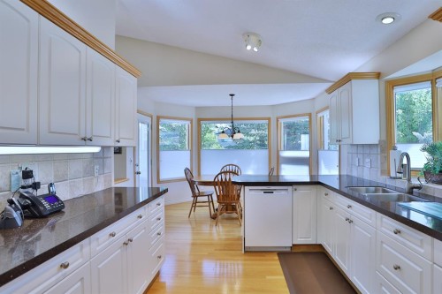 185 Hamptons Square Nw, Calgary, AB - Indoor Photo Showing Kitchen With Double Sink