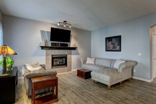 18380 Chaparral Street Se, Calgary, AB - Indoor Photo Showing Living Room With Fireplace