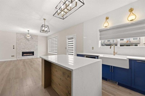 165 Canals Circle Sw, Airdrie, AB - Indoor With Fireplace