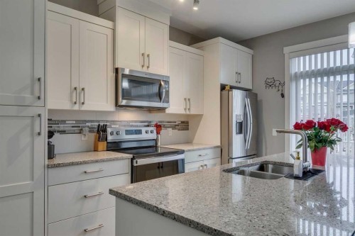 659 Evanston Manor Nw, Calgary, AB - Indoor Photo Showing Kitchen With Double Sink With Upgraded Kitchen