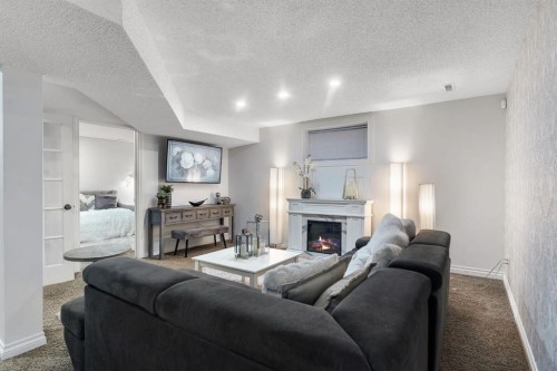 149 West Creek Boulevard, Chestermere, AB - Indoor Photo Showing Living Room With Fireplace