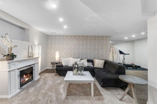 149 West Creek Boulevard, Chestermere, AB - Indoor Photo Showing Living Room With Fireplace