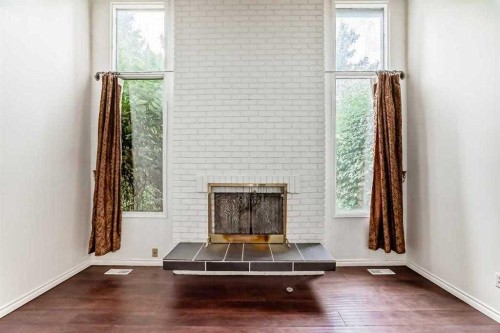 5-5400 Dalhousie Drive Nw, Calgary, AB - Indoor With Fireplace