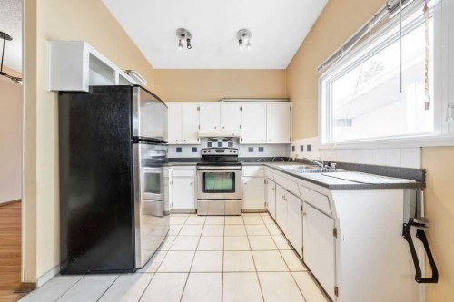 706 68 Avenue Sw, Calgary, AB - Indoor Photo Showing Kitchen With Double Sink