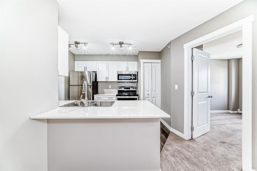 606-20 Kincora Glen Park Nw, Calgary, AB - Indoor Photo Showing Kitchen With Double Sink