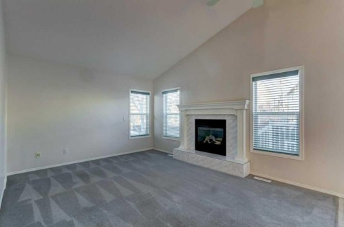 36 Brightondale Crescent Se, Calgary, AB - Indoor Photo Showing Living Room With Fireplace