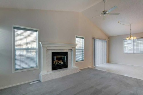 36 Brightondale Crescent Se, Calgary, AB - Indoor Photo Showing Living Room With Fireplace