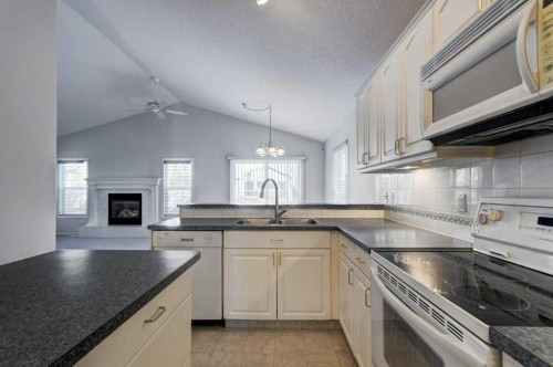36 Brightondale Crescent Se, Calgary, AB - Indoor Photo Showing Kitchen With Double Sink