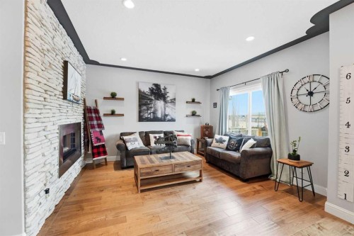166 Fireside Bend, Cochrane, AB - Indoor Photo Showing Living Room With Fireplace