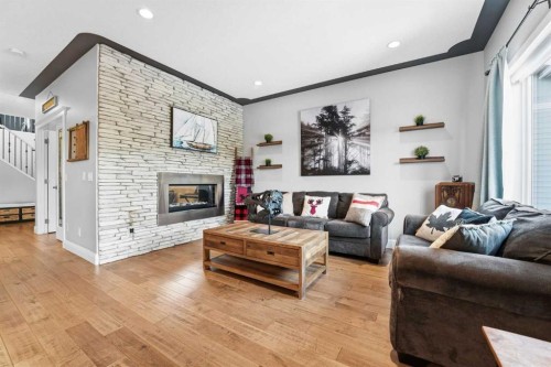 166 Fireside Bend, Cochrane, AB - Indoor Photo Showing Living Room With Fireplace