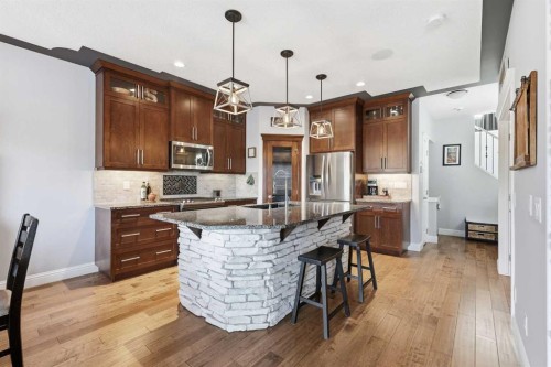 166 Fireside Bend, Cochrane, AB - Indoor Photo Showing Kitchen With Stainless Steel Kitchen With Upgraded Kitchen