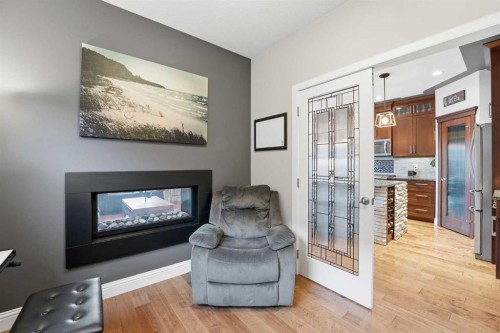 166 Fireside Bend, Cochrane, AB - Indoor Photo Showing Living Room With Fireplace
