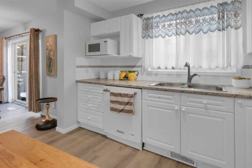 227 Harvest Gold Place Ne, Calgary, AB - Indoor Photo Showing Kitchen With Double Sink