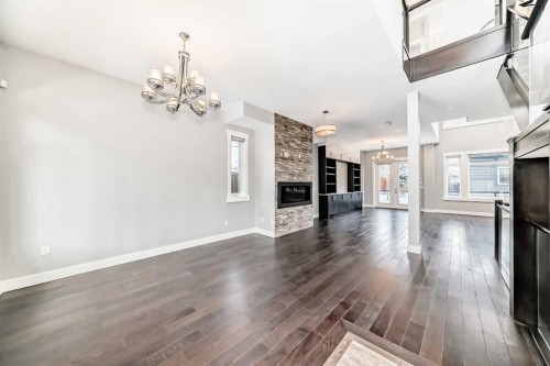 230 37 Street Nw, Calgary, AB - Indoor Photo Showing Living Room With Fireplace