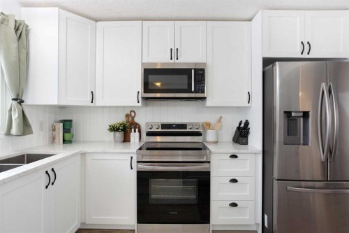 2348 Reunion Rise Nw, Airdrie, AB - Indoor Photo Showing Kitchen With Double Sink
