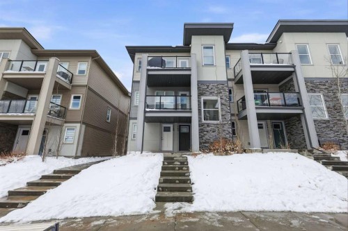 162 Spring Creek Common Sw, Calgary, AB - Outdoor With Balcony With Facade