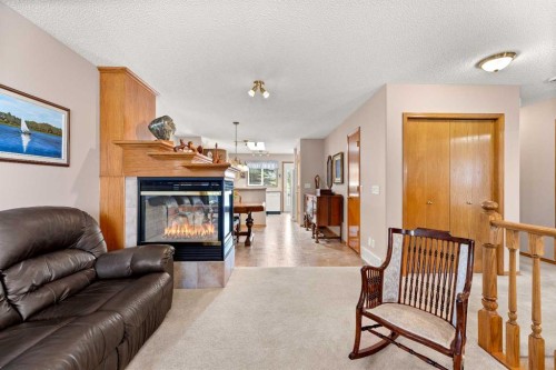 164 Stonegate Close Nw, Airdrie, AB - Indoor Photo Showing Living Room With Fireplace