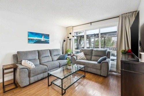 42 Cedarwood Hill Sw, Calgary, AB - Indoor Photo Showing Living Room