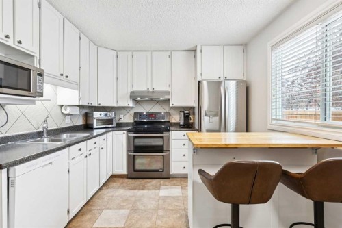 42 Cedarwood Hill Sw, Calgary, AB - Indoor Photo Showing Kitchen With Stainless Steel Kitchen With Double Sink
