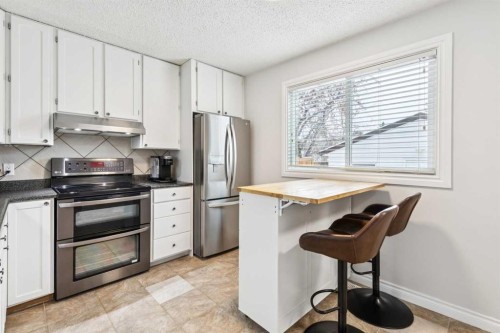 42 Cedarwood Hill Sw, Calgary, AB - Indoor Photo Showing Kitchen With Stainless Steel Kitchen
