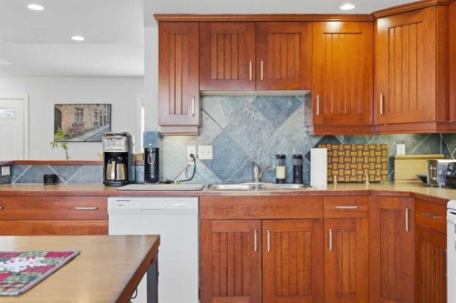 172 Somme Manor Sw, Calgary, AB - Indoor Photo Showing Kitchen With Double Sink