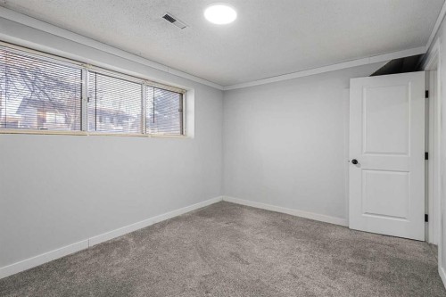 255 Rundleridge Drive Ne, Calgary, AB - Indoor Photo Showing Other Room