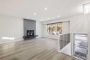 255 Rundleridge Drive Ne, Calgary, AB  - Indoor Photo Showing Other Room With Fireplace 