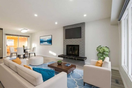 255 Rundleridge Drive Ne, Calgary, AB - Indoor Photo Showing Living Room With Fireplace