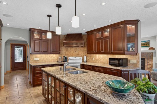 11 Sun Canyon Park Se, Calgary, AB - Indoor Photo Showing Kitchen With Double Sink