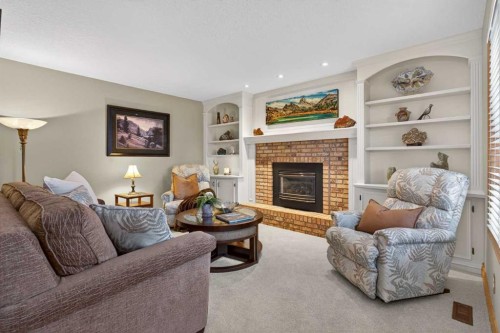11 Sun Canyon Park Se, Calgary, AB - Indoor Photo Showing Living Room With Fireplace