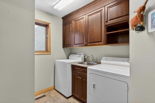 11 Sun Canyon Park Se, Calgary, AB - Indoor Photo Showing Laundry Room