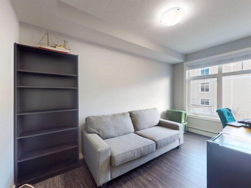 2207-3727 Sage Hill Drive Nw, Calgary, AB - Indoor Photo Showing Living Room