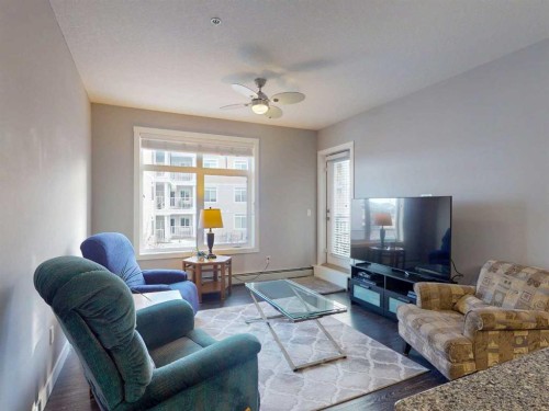 2207-3727 Sage Hill Drive Nw, Calgary, AB - Indoor Photo Showing Living Room