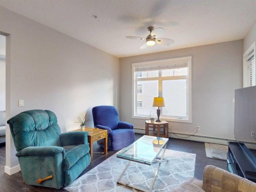 2207-3727 Sage Hill Drive Nw, Calgary, AB - Indoor Photo Showing Living Room