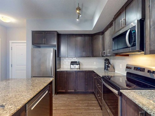 2207-3727 Sage Hill Drive Nw, Calgary, AB - Indoor Photo Showing Kitchen With Upgraded Kitchen