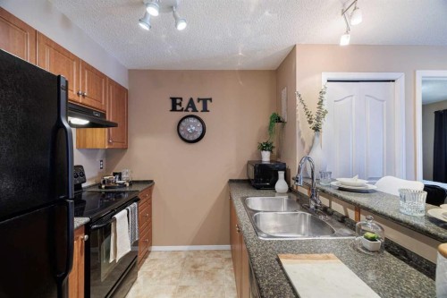 3418-60 Panatella Street Nw, Calgary, AB - Indoor Photo Showing Kitchen With Double Sink