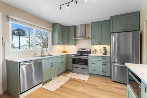 7819 Fairmount Drive Se, Calgary, AB - Indoor Photo Showing Kitchen With Double Sink With Upgraded Kitchen