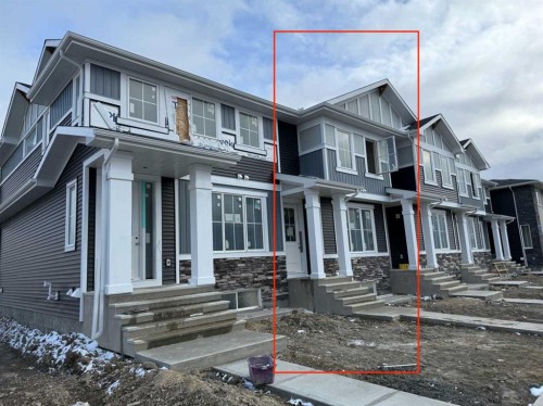 338 Sundown Road, Cochrane, AB - Outdoor With Facade