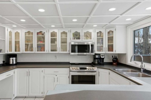 127 Queen Tamara Road Se, Calgary, AB - Indoor Photo Showing Kitchen With Double Sink