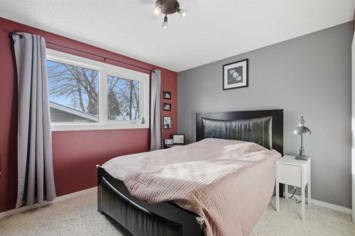 127 Queen Tamara Road Se, Calgary, AB - Indoor Photo Showing Bedroom