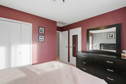 127 Queen Tamara Road Se, Calgary, AB - Indoor Photo Showing Bedroom