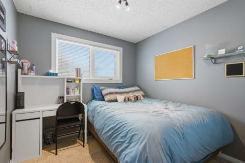 127 Queen Tamara Road Se, Calgary, AB - Indoor Photo Showing Bedroom