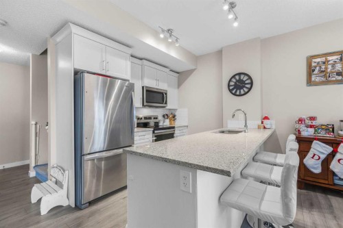 811-250 Fireside View, Cochrane, AB - Indoor Photo Showing Kitchen With Stainless Steel Kitchen With Upgraded Kitchen